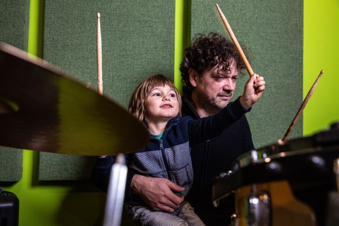 Father and son playing drums