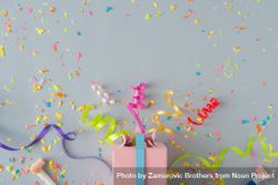 Present with confetti and colorful streamings on grey background 5aPXQ0