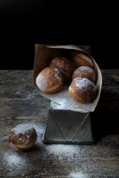 Baked cakes in craft paper on table