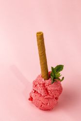 Strawberry ice cream scoops with waffle stick