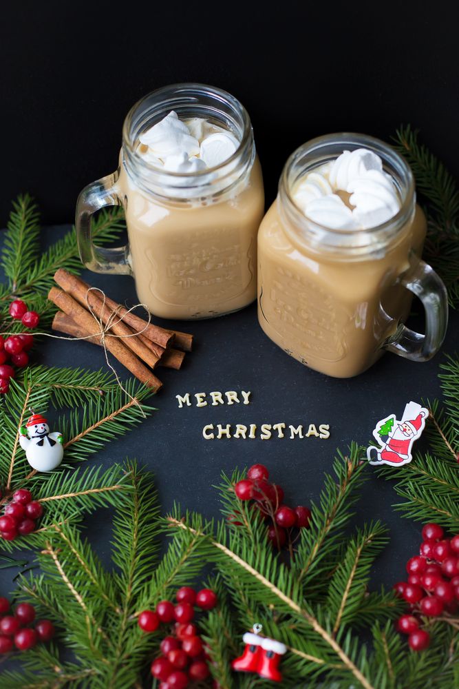 marshmellou hot cocoa trees in the background. The inscription Merry Christmas