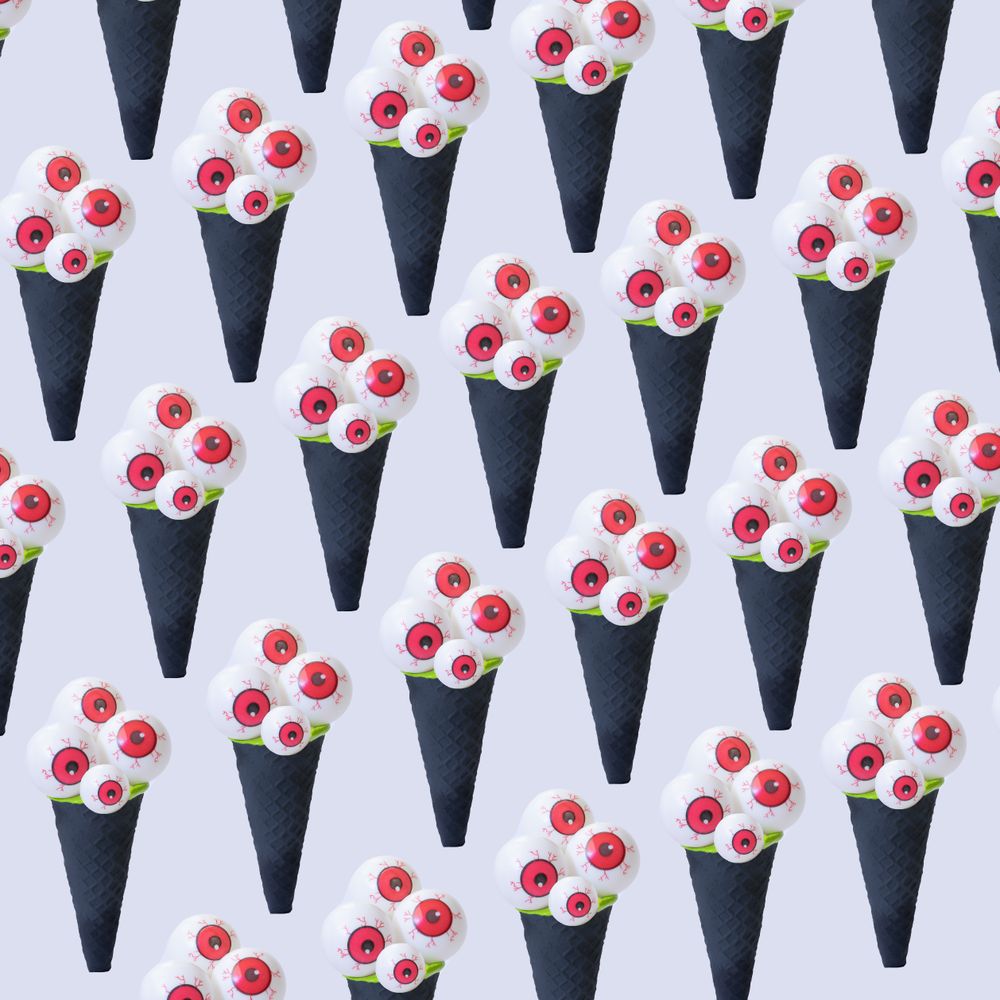 Row of eyeballs in dark ice cream cone in halloween concept