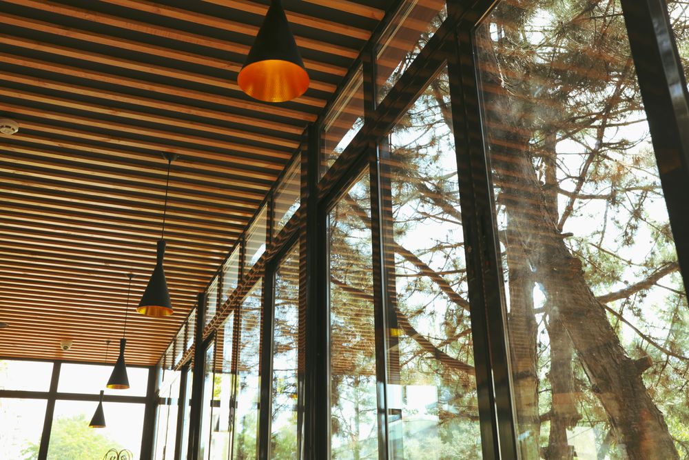 Window and stylish wooden ceiling in restaurant