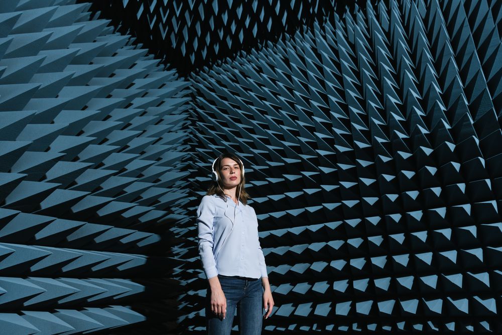 Woman in sound room listening to music