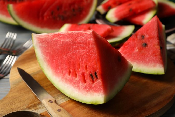Composition with watermelon slices on gray wooden table. Summer fruit
