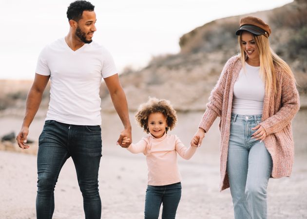Stylish multiethnic family walking on nature