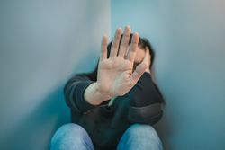 Unrecognizable woman  refusing help with hand