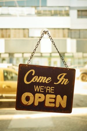 Open sign at small business window