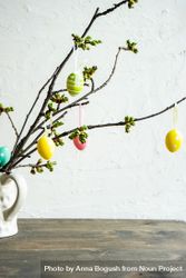 Decorative Easter eggs on branch in vase bDjjxV