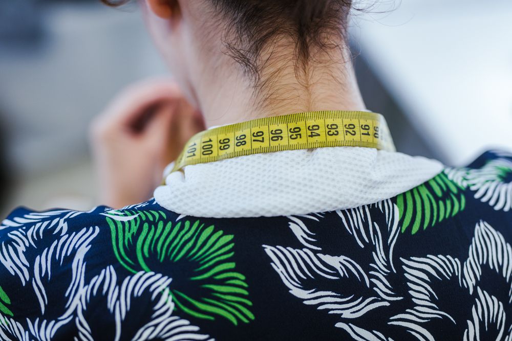 Woman in a sewing school