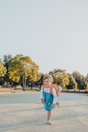 Little girl standing in park