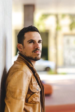 Stylish man outside modern building
