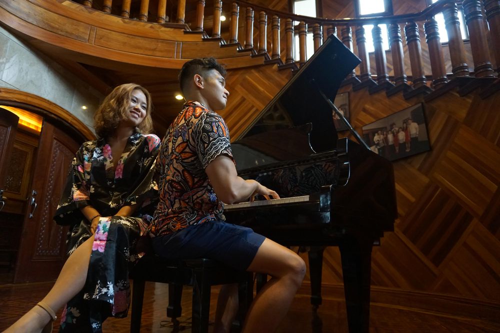 Man playing piano for his date
