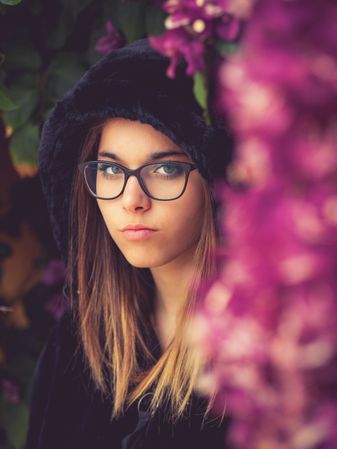 Woman on background of stunning violet flowers