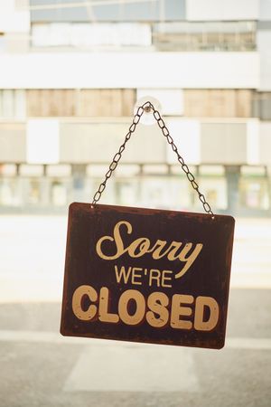 Close sign at small business window