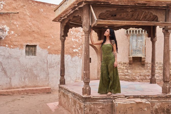 Woman dancing on street stage between ancient buildings