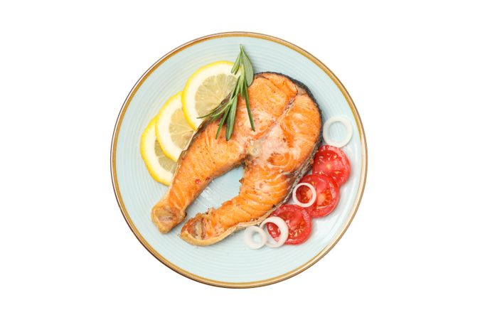 Plate with grilled salmon isolated on blank background