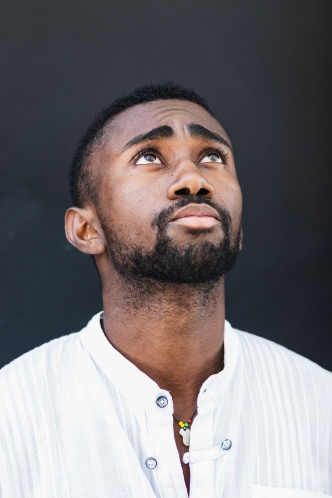 Black man in trendy clothes in city