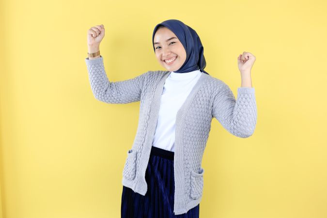 Excited Young Asian Muslim Woman