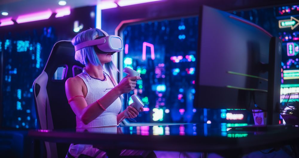 Young Cosplay Female Exploring VR Metaverse Online While Sitting Behind a Desk with Computer