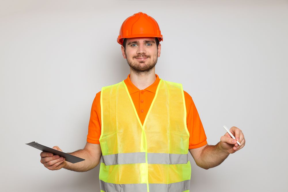 Young man civil engineer in safety hat