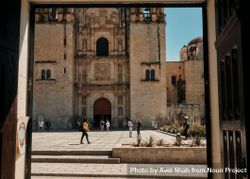 People in courtyard of church in Oaxaca 5pR78b