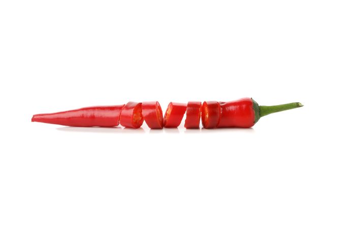 Chopped chilli pepper isolated on studio background