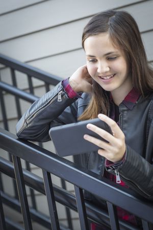 Young Girl Looking at Smart Phone
