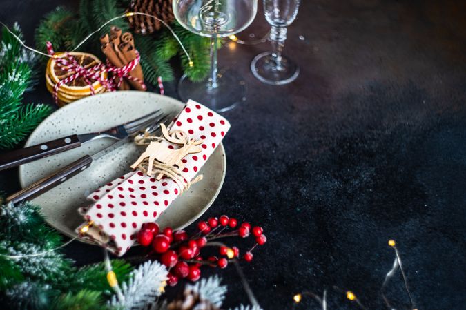 Christmas table setting with ornaments and dried orange slices