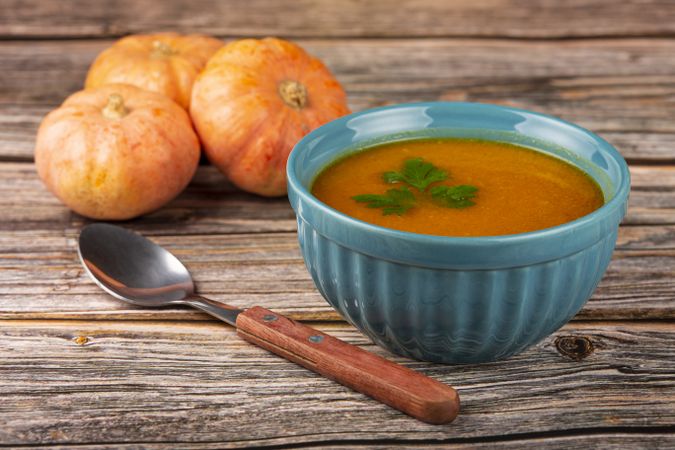 Delicious homemade pumpkin soup in bowl.