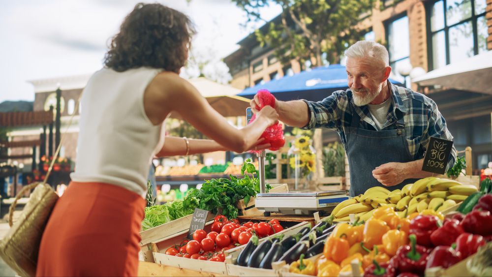 Cheerful Local Farmer Running a Small Business, Selling Sustainable Farm Fruits and Vegetables.