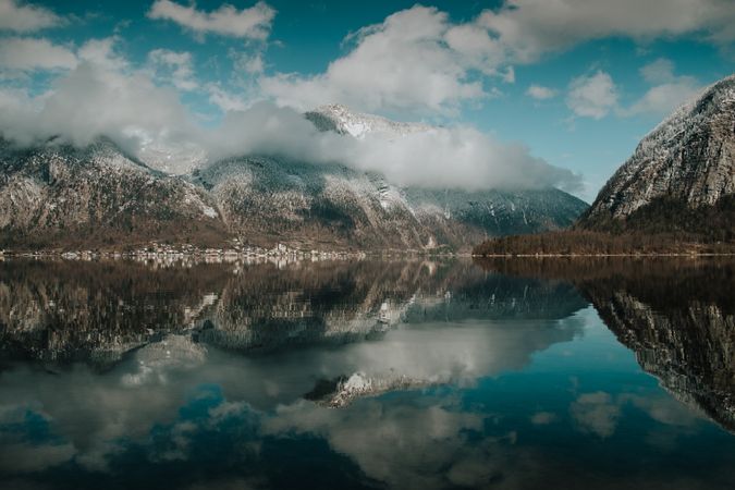 Perfect turquoise lake reflecting cloudy sky