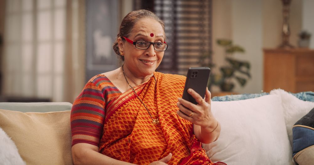 Mature Indian Woman Using Video Call on Smartphone