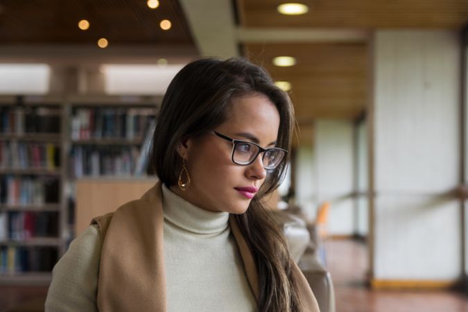 Woman in glasses reading a book