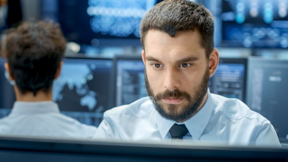Neural Network and Machine Learning Engineer Programming at His Workstation.