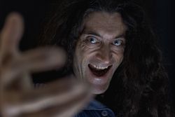 Intense Close-Up Portrait of a Man Reaching Out.