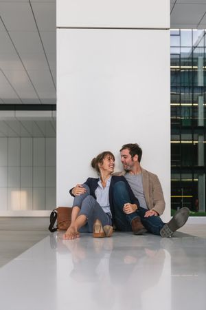 Businesspeople resting outside modern building