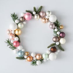 Christmas wreath made of decorative baubles and branches