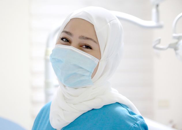 Dental doctor woman in hijab wearing face mask
