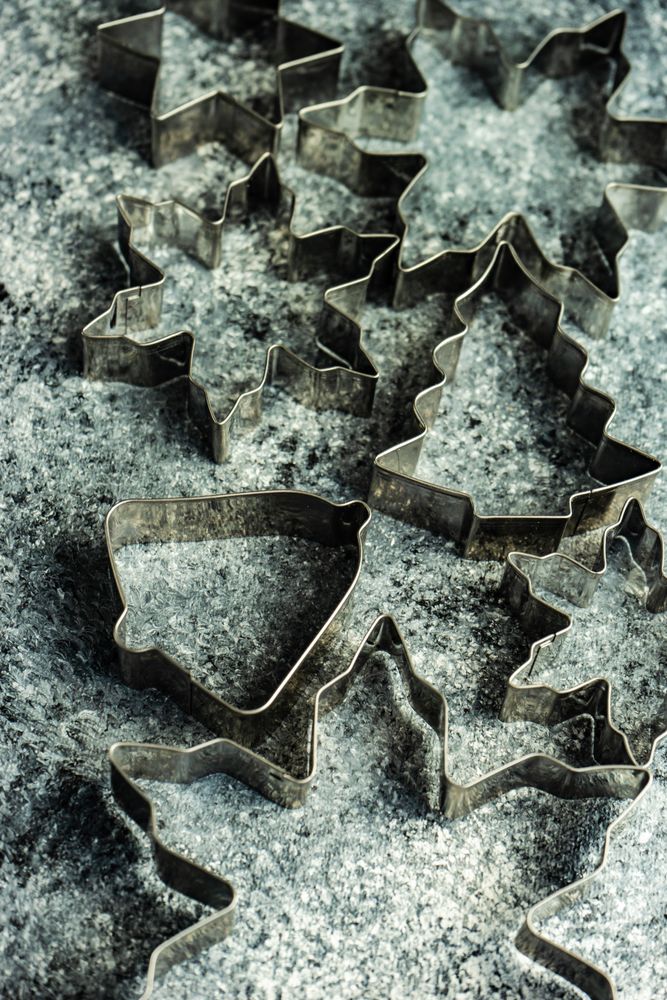 Top view of cookie cutters scattered on table