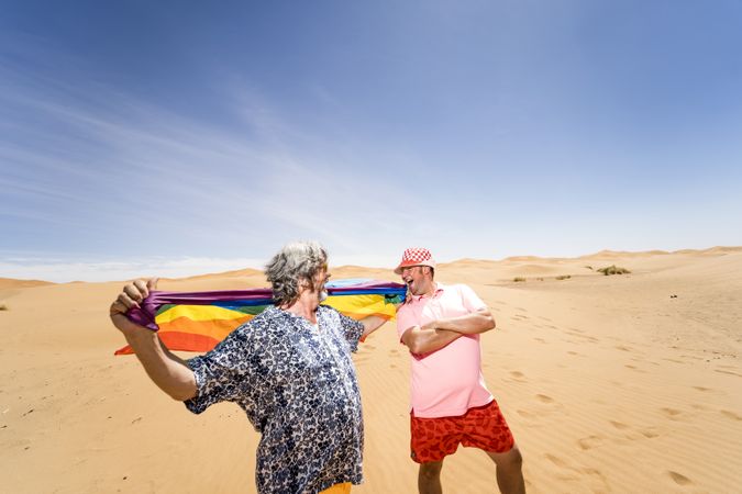 Excited gay couple in desert