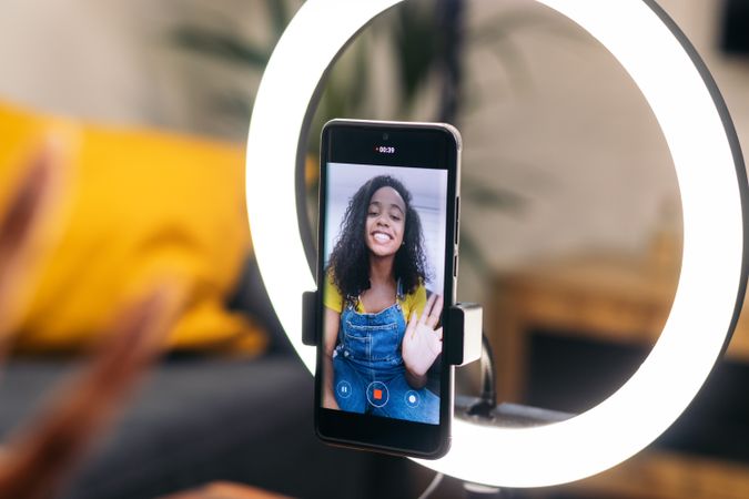 Young woman creates content with phone