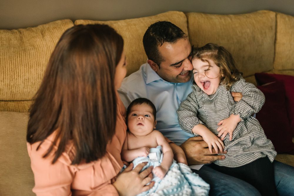 Happy family sitting on couch together