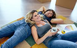 Couple resting lying on the carpet
