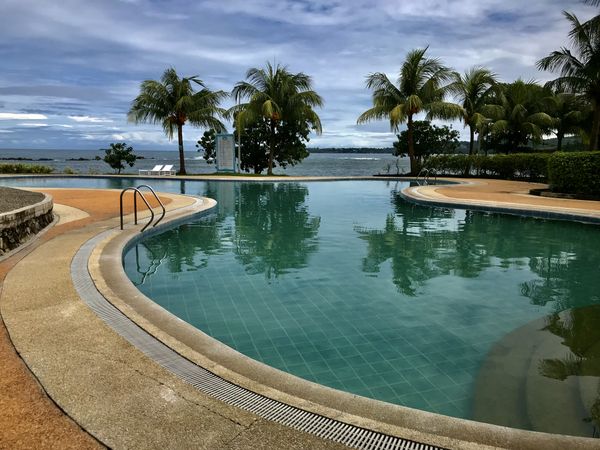 swimming pool with beach view summer