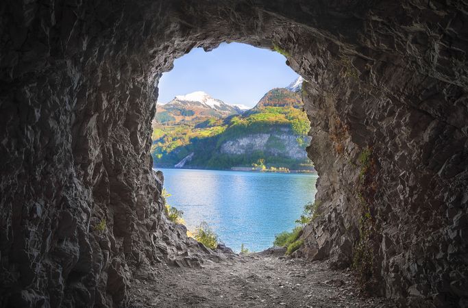 Mountain cave with view of lake and mountains