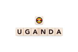 Wooden blocks bearing the name and flag of Uganda.