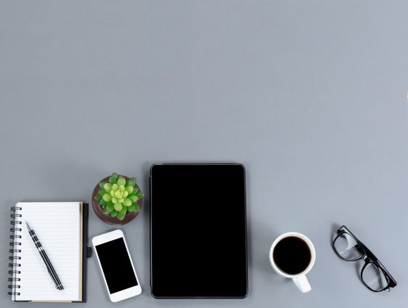 Flat gray desk with functional modern wireless technology