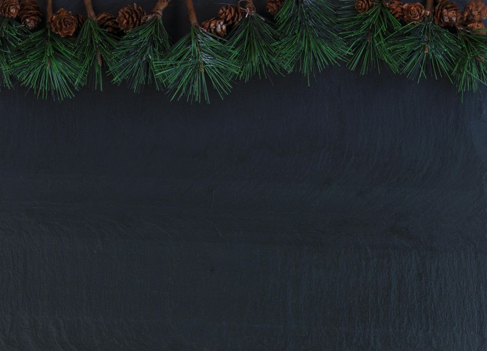 Christmas setting with fir tip branches on stone setting