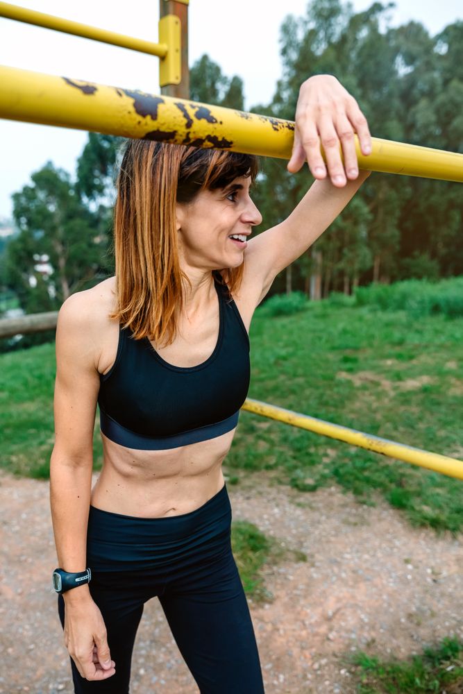 Tired athlete woman after training